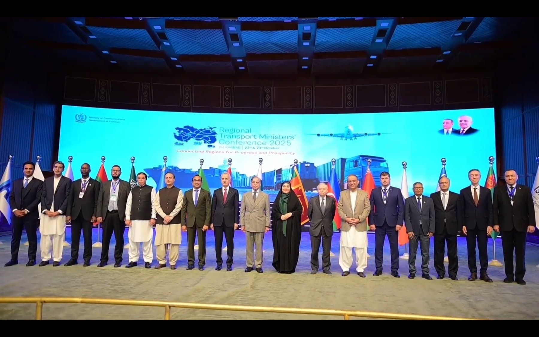 The Regional Transport Ministers' Conference 2025 — 19 heads of delegation from participating nations on stage at the Jinnah Convention Centre, with the conference theme 'Connecting Regions for Progress and Prosperity' visible on the backdrop.